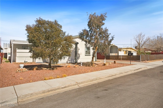 obstructed view of property featuring fence