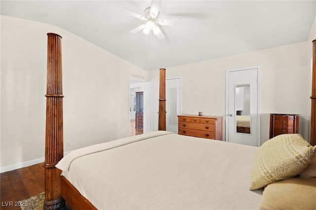 bedroom featuring a ceiling fan, vaulted ceiling, baseboards, and wood finished floors