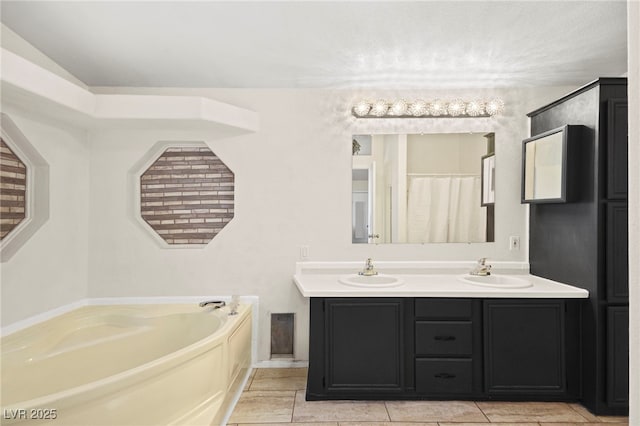 full bathroom featuring tile patterned floors, a garden tub, a sink, and double vanity