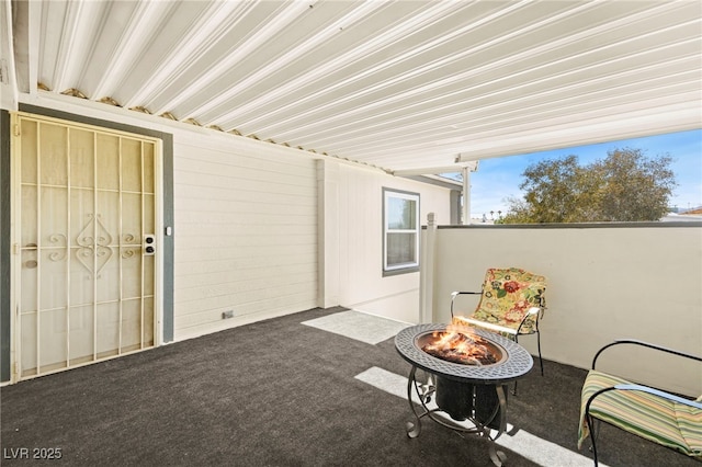 view of patio featuring a fire pit