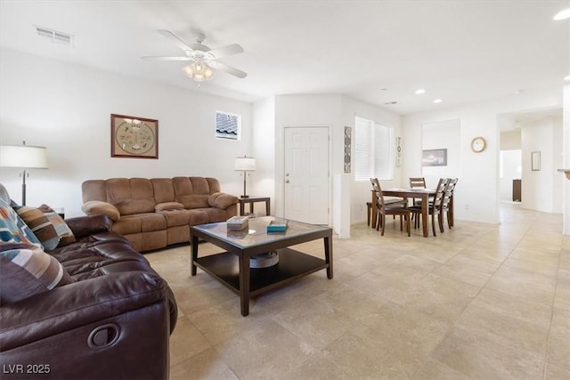 living area featuring ceiling fan, visible vents, and recessed lighting