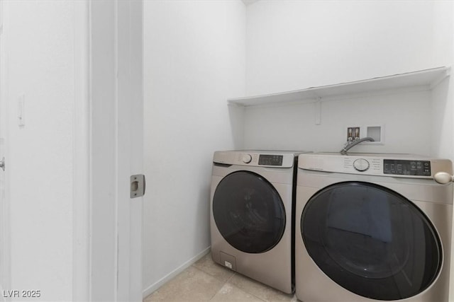 laundry room featuring light tile patterned floors, laundry area, independent washer and dryer, and baseboards