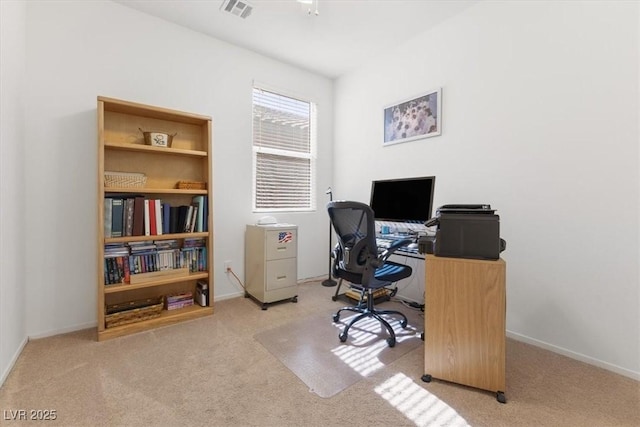 home office featuring carpet floors, visible vents, and baseboards