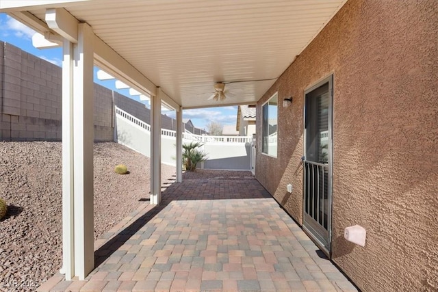 view of patio / terrace with a fenced backyard and a ceiling fan