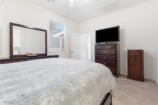 bedroom with ceiling fan, baseboards, and light colored carpet