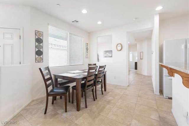 dining space with recessed lighting, visible vents, baseboards, and light tile patterned floors