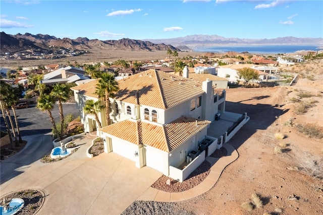 drone / aerial view featuring a mountain view