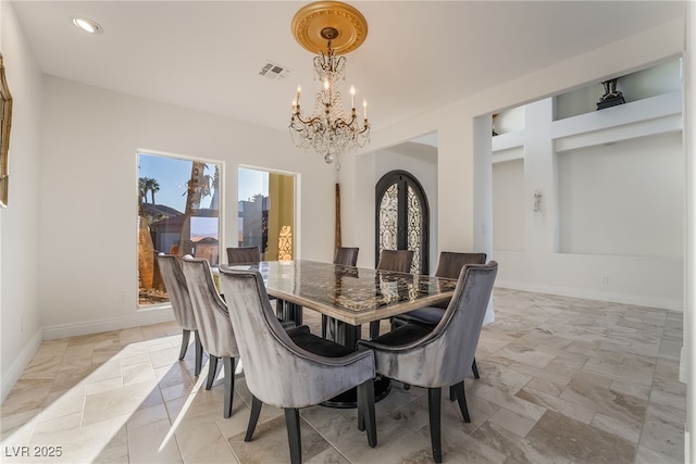 dining space featuring baseboards, visible vents, french doors, a chandelier, and recessed lighting