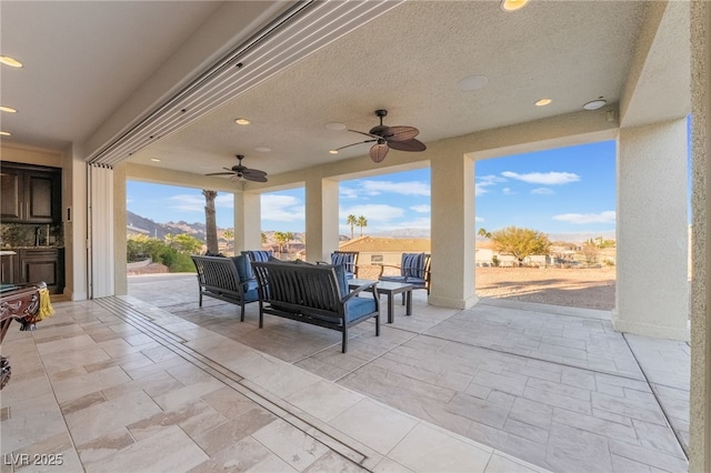 view of patio / terrace with a ceiling fan