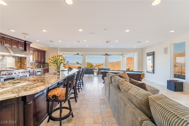 living room with billiards, visible vents, baseboards, and recessed lighting