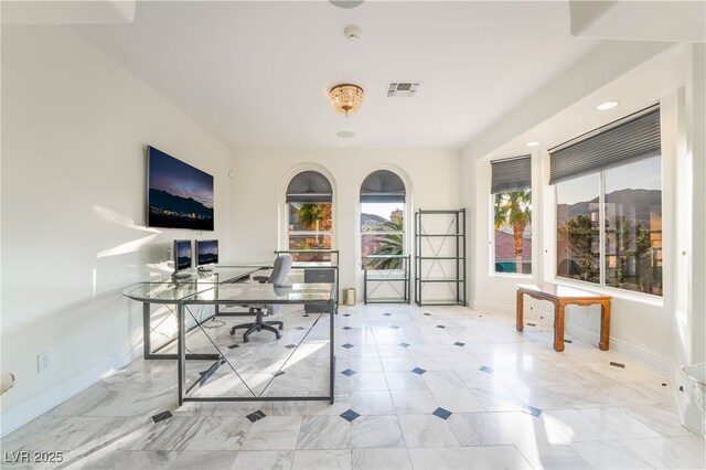 unfurnished office with visible vents and baseboards