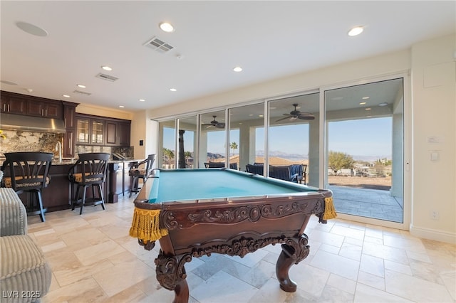 rec room with recessed lighting, a healthy amount of sunlight, visible vents, and baseboards