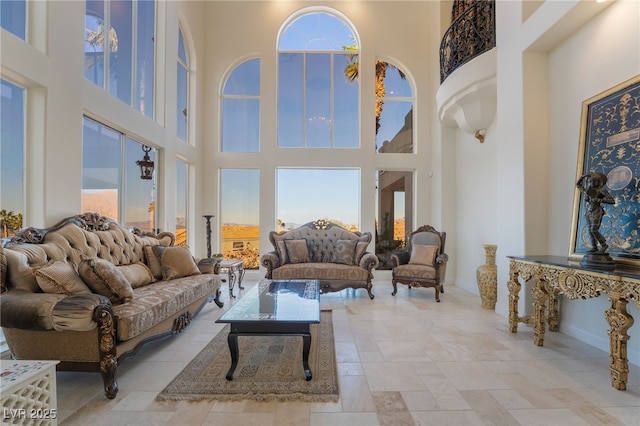 living area with a high ceiling