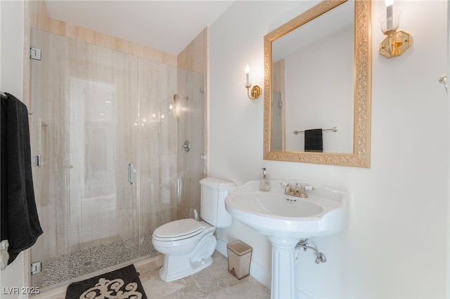 full bathroom featuring a shower stall and toilet