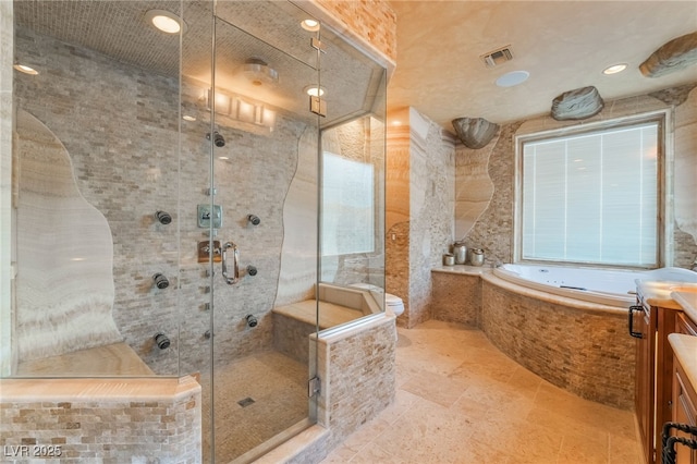 full bath with a stall shower, visible vents, toilet, vanity, and a bath