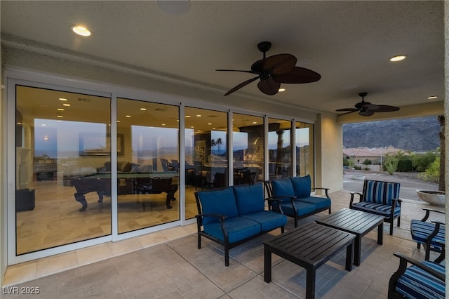 view of patio / terrace featuring an outdoor living space and a ceiling fan