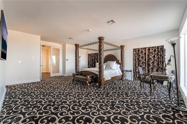 carpeted bedroom featuring visible vents and baseboards