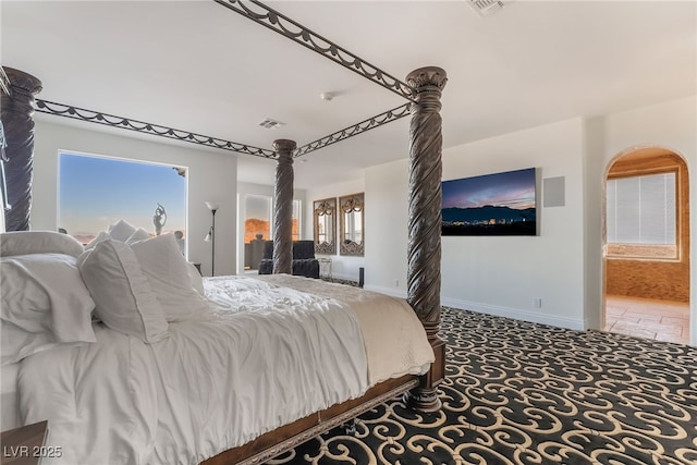 carpeted bedroom with multiple windows, visible vents, and baseboards