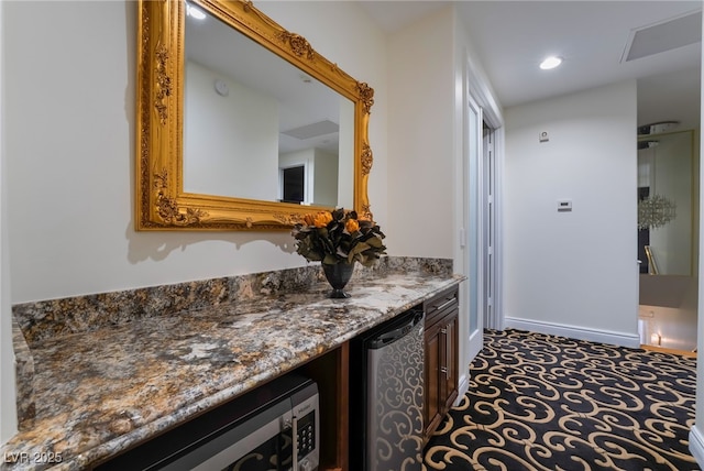 hallway featuring baseboards