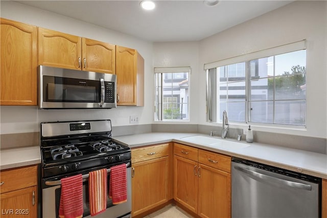 3331 Cheltenham St, Las Vegas, NV 89129 - kitchen with appliances with stainless steel finishes, a sink, light countertops, and recessed lighting