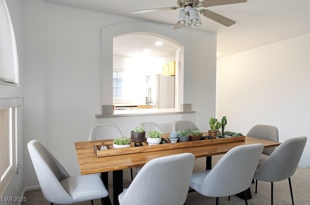 3331 Cheltenham St, Las Vegas, NV 89129 - dining room featuring arched walkways, carpet flooring, and ceiling fan