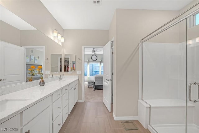 7177 W Camero Ave, Las Vegas, NV 89113 - bathroom featuring double vanity, visible vents, ensuite bathroom, a sink, and a shower stall