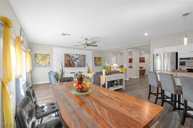 7177 W Camero Ave, Las Vegas, NV 89113 - dining area featuring a ceiling fan, dark wood-style flooring, visible vents, and baseboards