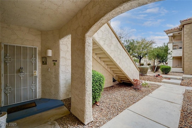 property entrance featuring stucco siding