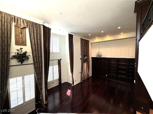 interior space featuring ornamental molding, recessed lighting, dark wood-style flooring, and baseboards