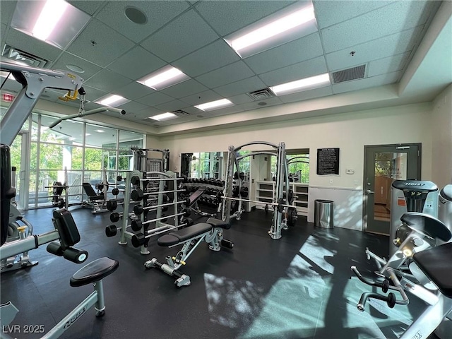 workout area featuring a drop ceiling and visible vents