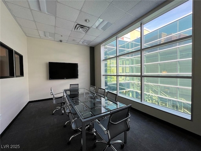 carpeted home office with a paneled ceiling, baseboards, and visible vents