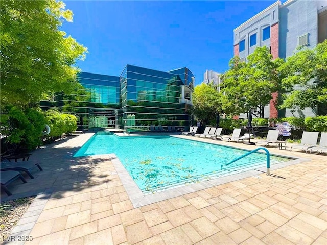 pool featuring a patio and fence