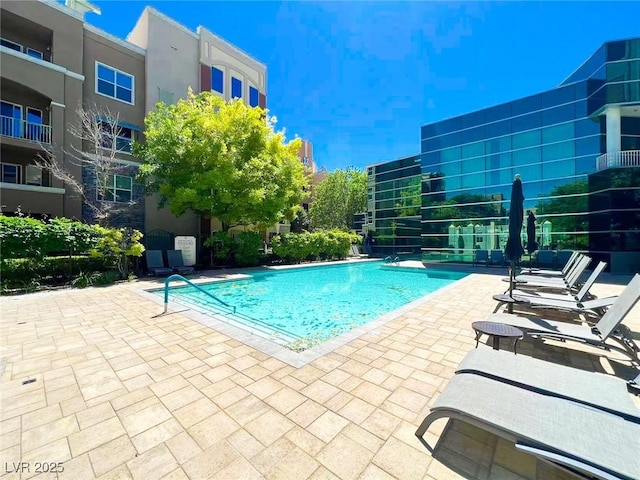 community pool with a patio area