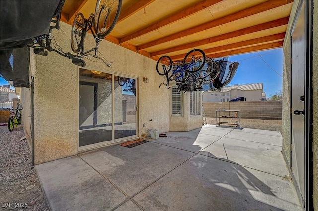 view of patio / terrace featuring fence