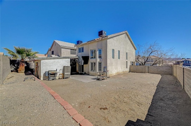 back of property featuring central air condition unit, a patio area, a fenced backyard, and stucco siding