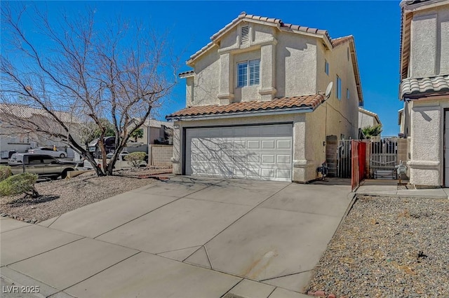 view of front of house with a garage, concrete driveway, a tiled roof, and stucco siding