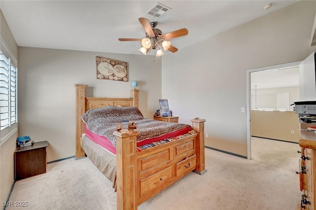 bedroom with light carpet, ceiling fan, and visible vents