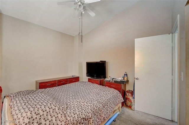 bedroom featuring lofted ceiling, a ceiling fan, and light colored carpet