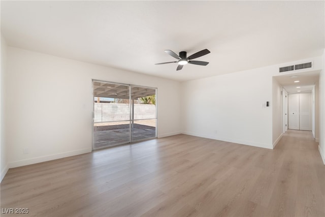 unfurnished room with light wood-style flooring, visible vents, ceiling fan, and baseboards