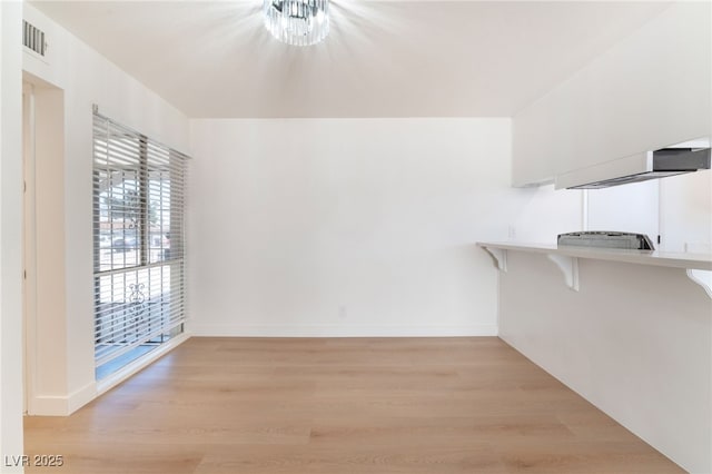 walk in closet with visible vents and light wood-style flooring