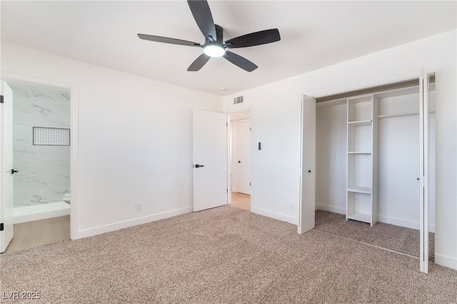 unfurnished bedroom featuring carpet floors, a closet, visible vents, and baseboards