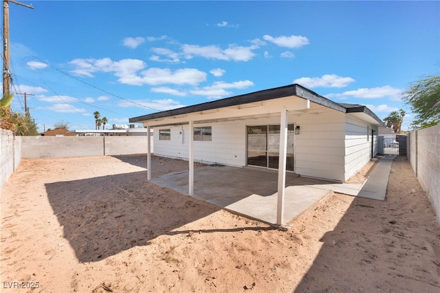 back of house with a patio area and a fenced backyard