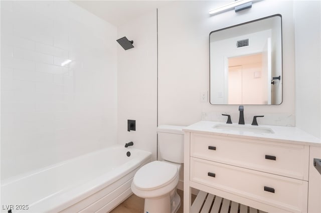 bathroom with visible vents, shower / bathing tub combination, vanity, and toilet