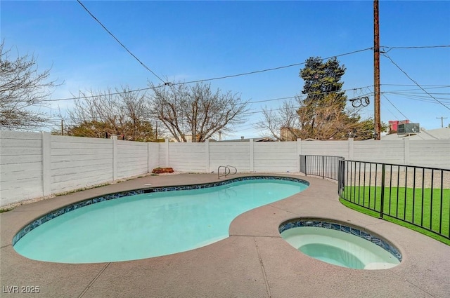 view of pool with a fenced in pool, a fenced backyard, and an in ground hot tub