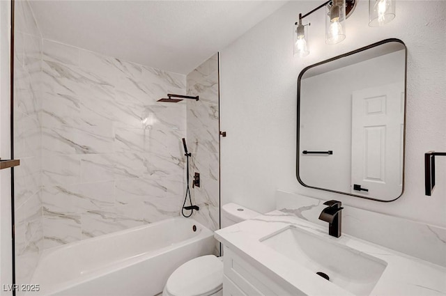 bathroom featuring toilet, shower / bathing tub combination, and vanity