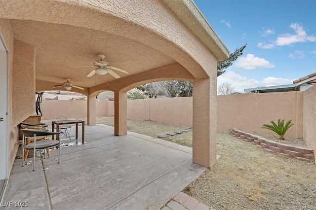 view of patio / terrace featuring a fenced backyard and a ceiling fan