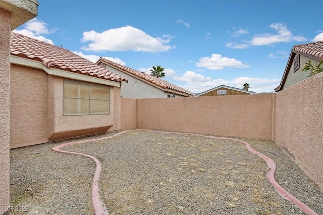 view of yard featuring a patio area and a fenced backyard