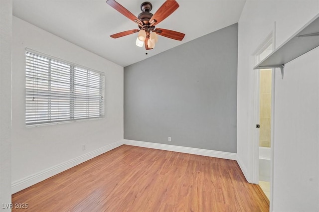 empty room with light wood-style floors, baseboards, and a ceiling fan