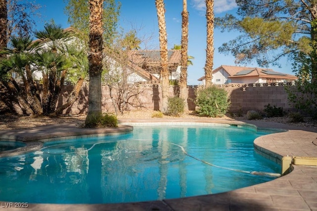 view of swimming pool featuring a patio area, a fenced backyard, and a fenced in pool