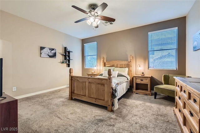 bedroom with a ceiling fan, visible vents, light carpet, and baseboards